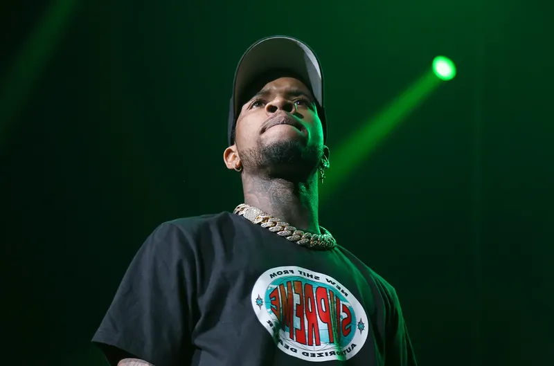 Tory Lanez performs onstage during a concert before his incarceration.